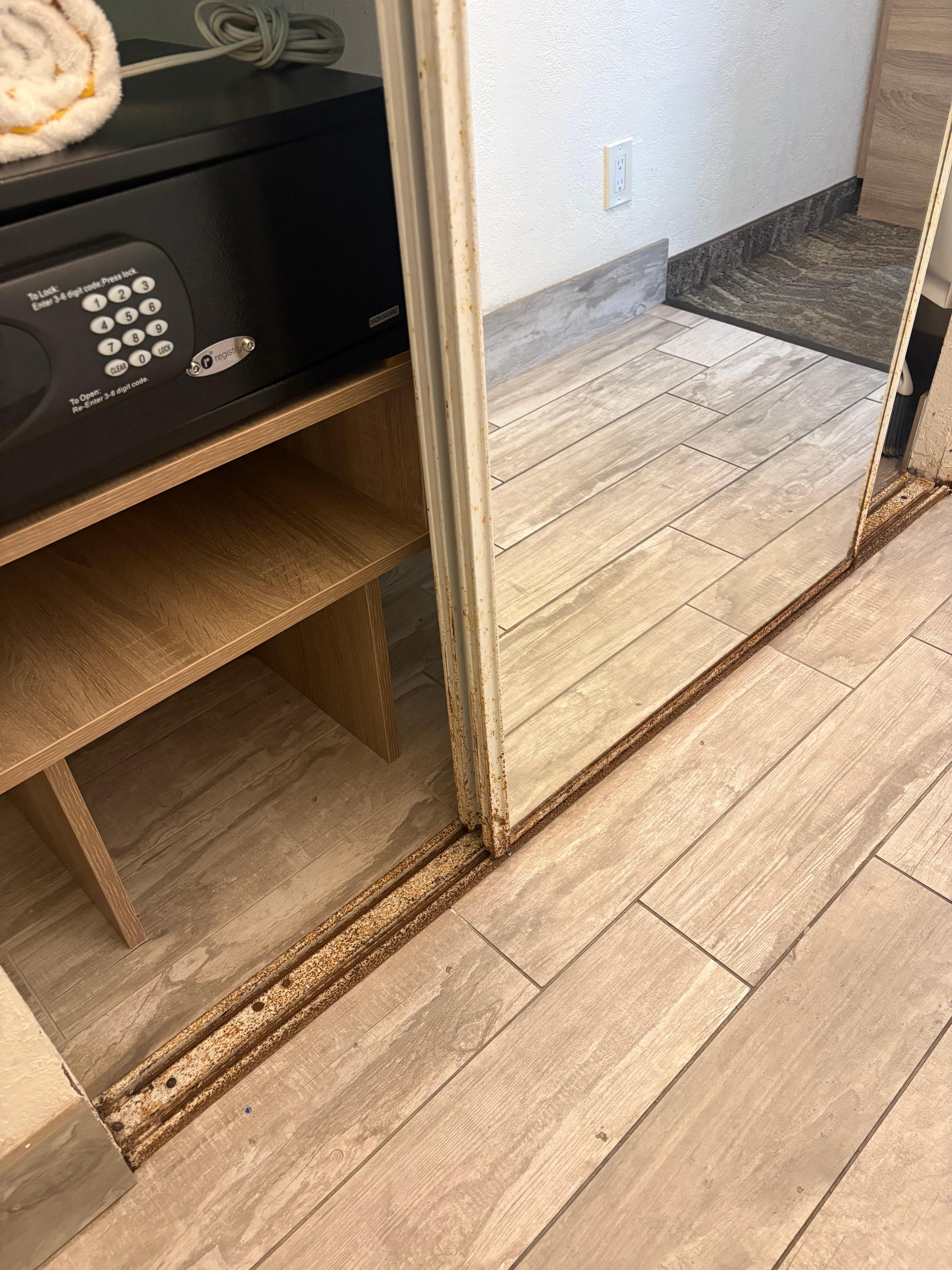 Safe that doesn’t work and rusty sliding closet doors.