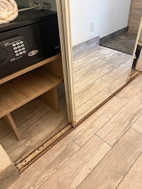 Safe that doesn’t work and rusty sliding closet doors.