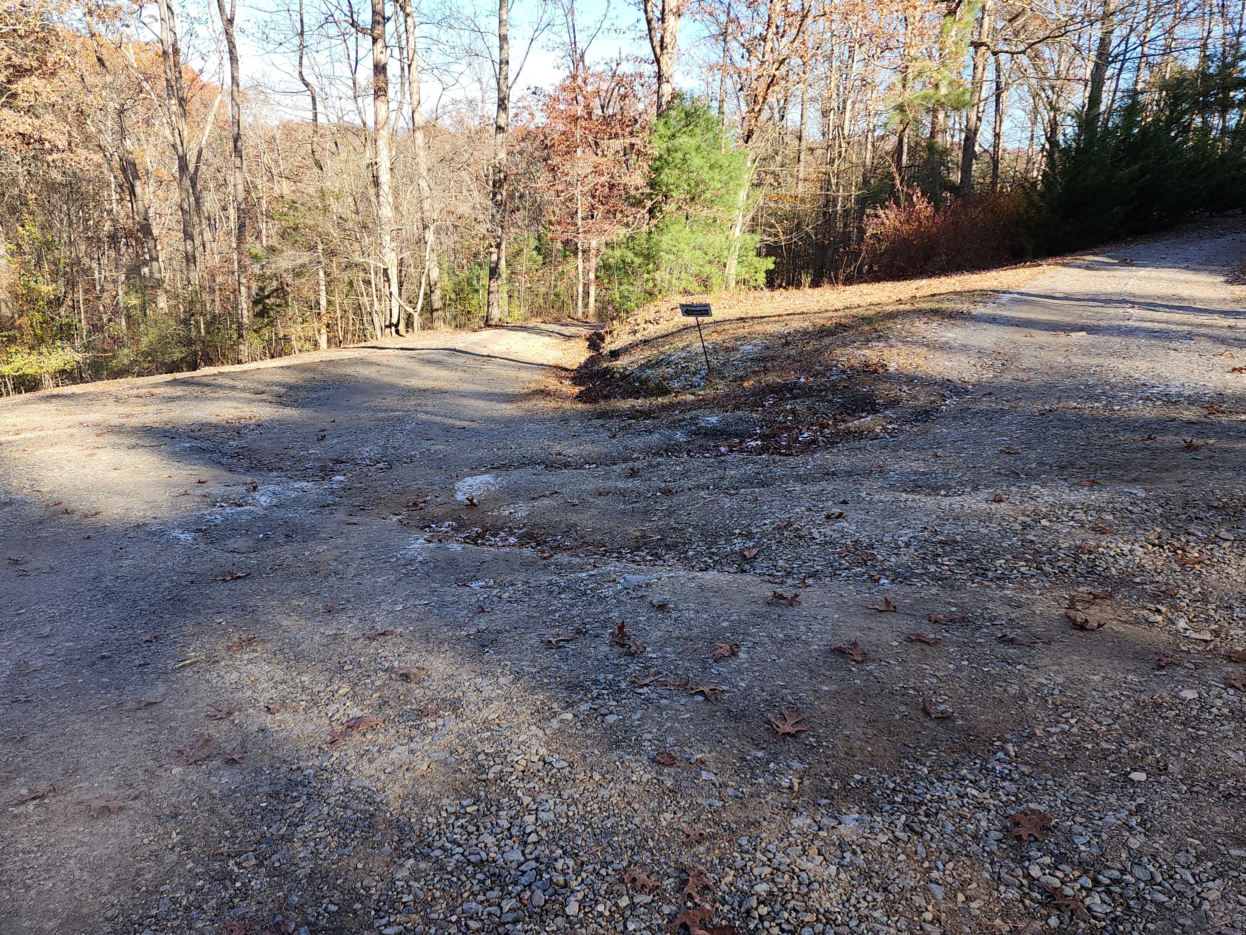 This is a photo of the sign (you have to zoom in to see it) and where you have to turn to get to the cabin.