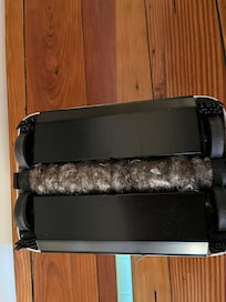 Manual vac completely clogged with dirt and grime.