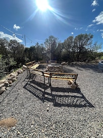 Firepit and seating area in parking lot in front of Castia