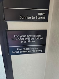 Sign stating doors to be locked. Still not locked after 11pm