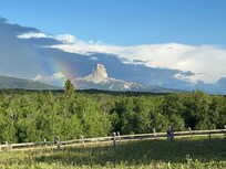 View of Chief Mountain from front yard of Stone House