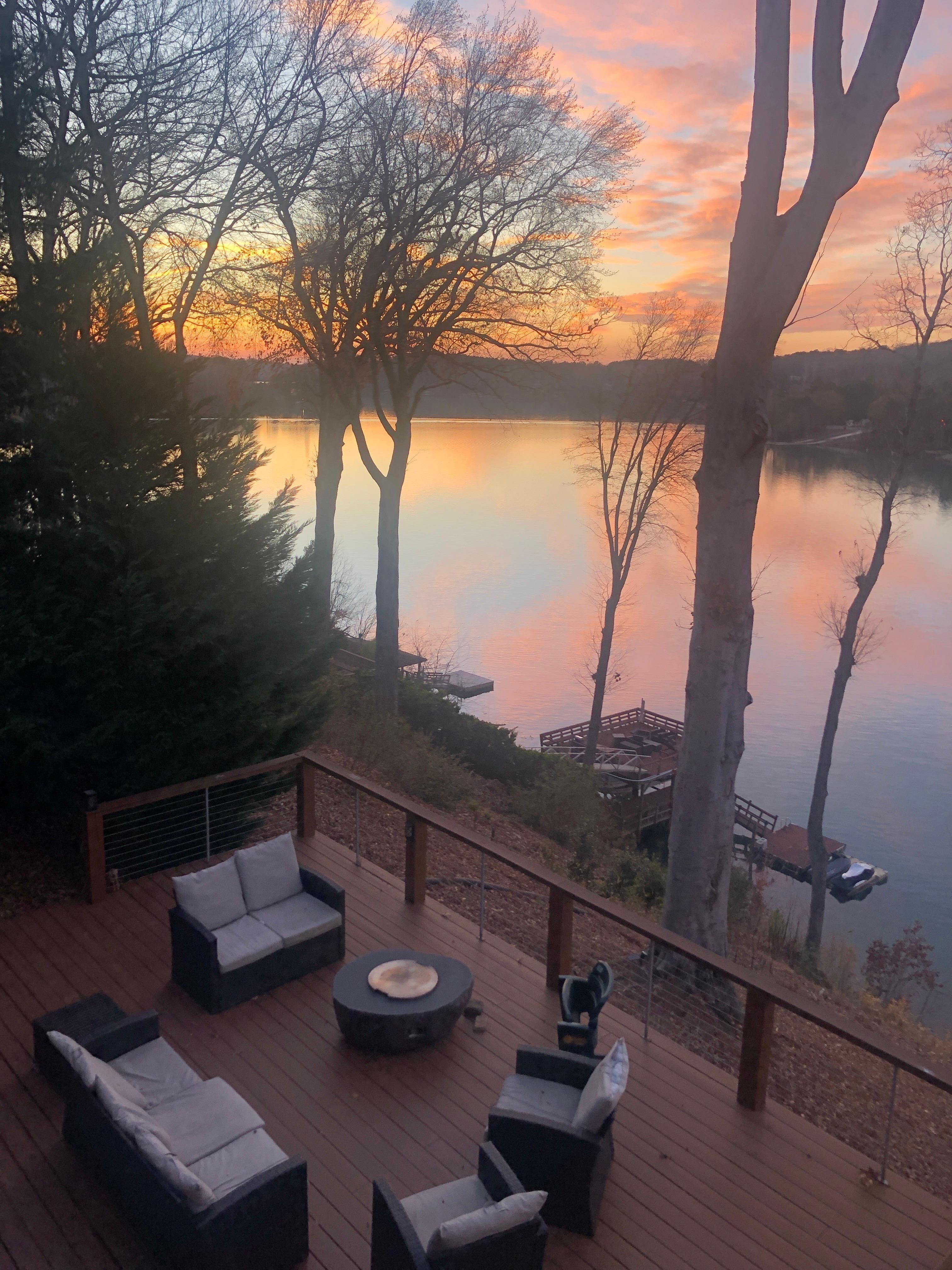 View from top deck to bottom fire pit patio