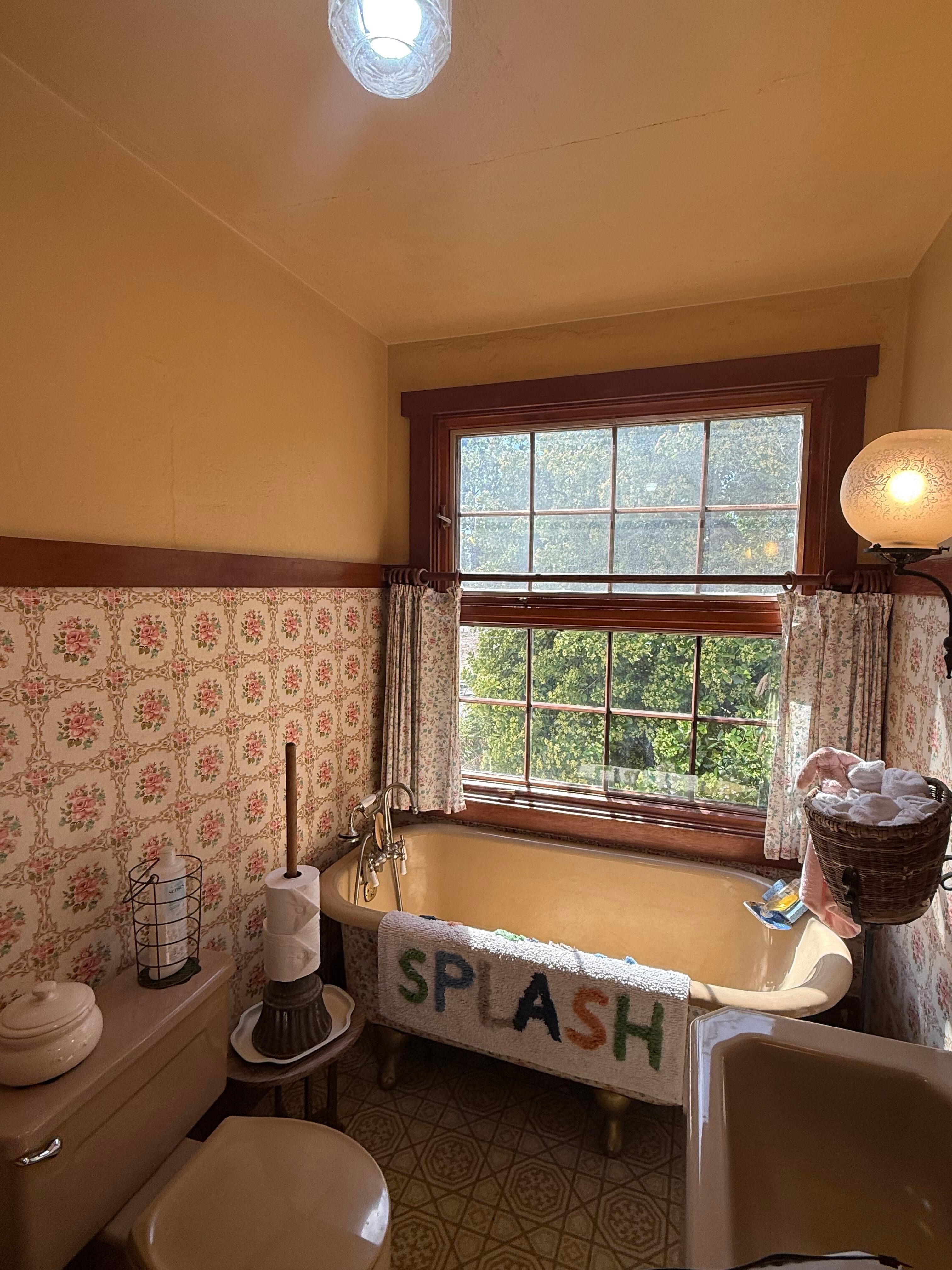 Guest bathroom, very clean, well lit and stocked with amenities 