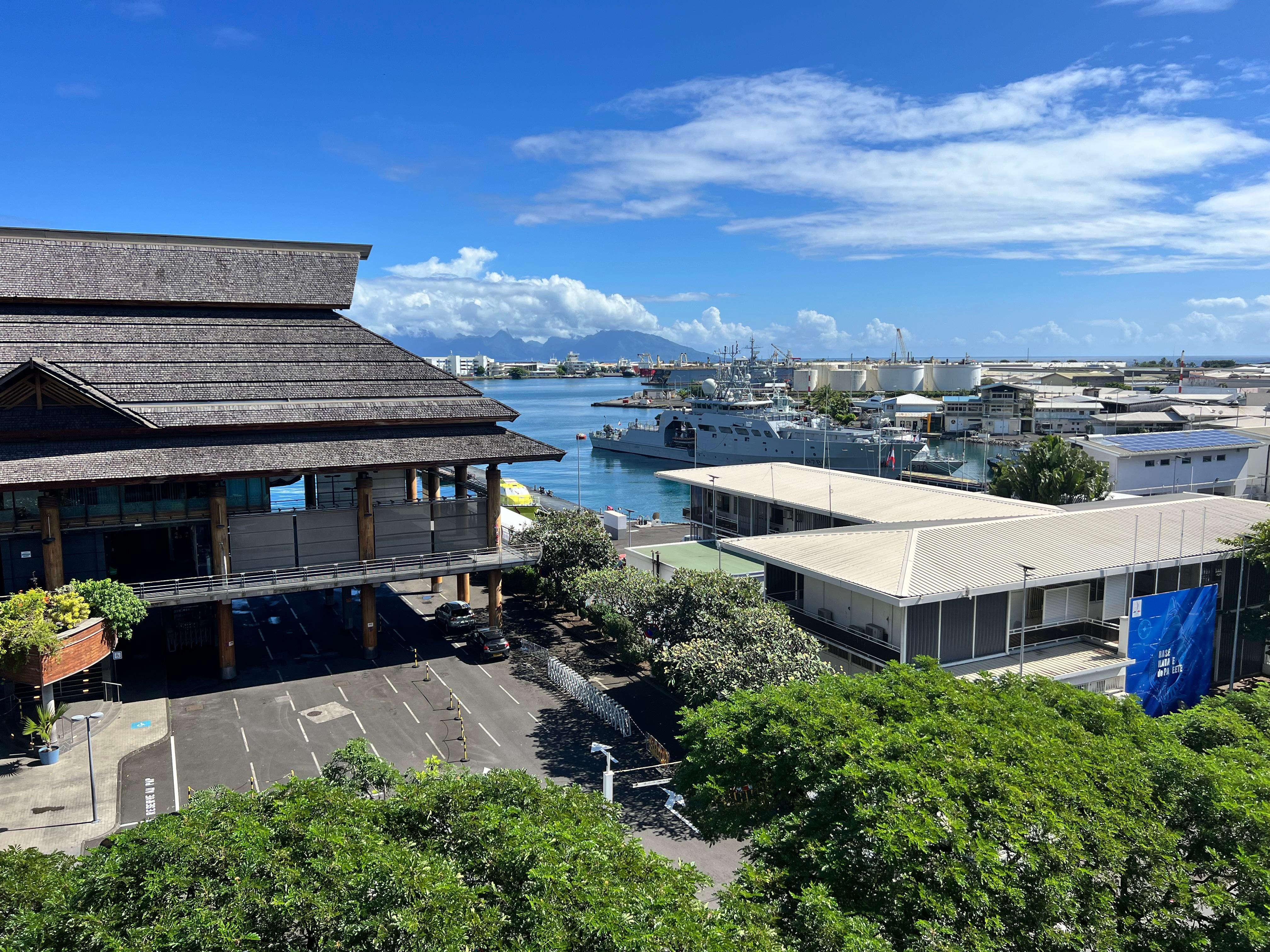 View from balcony, with ferry building and ocean