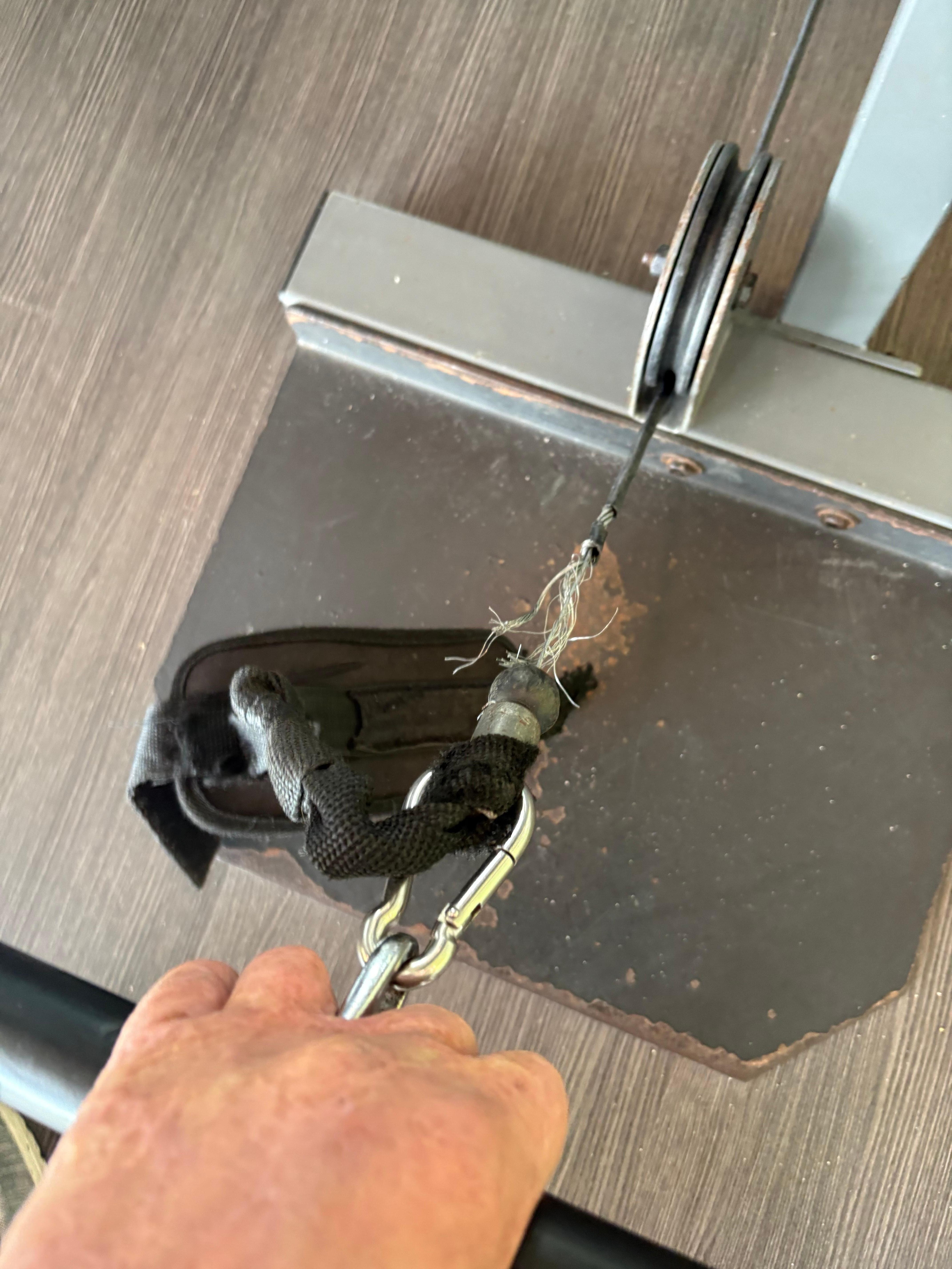 Frayed cable on weight machine 