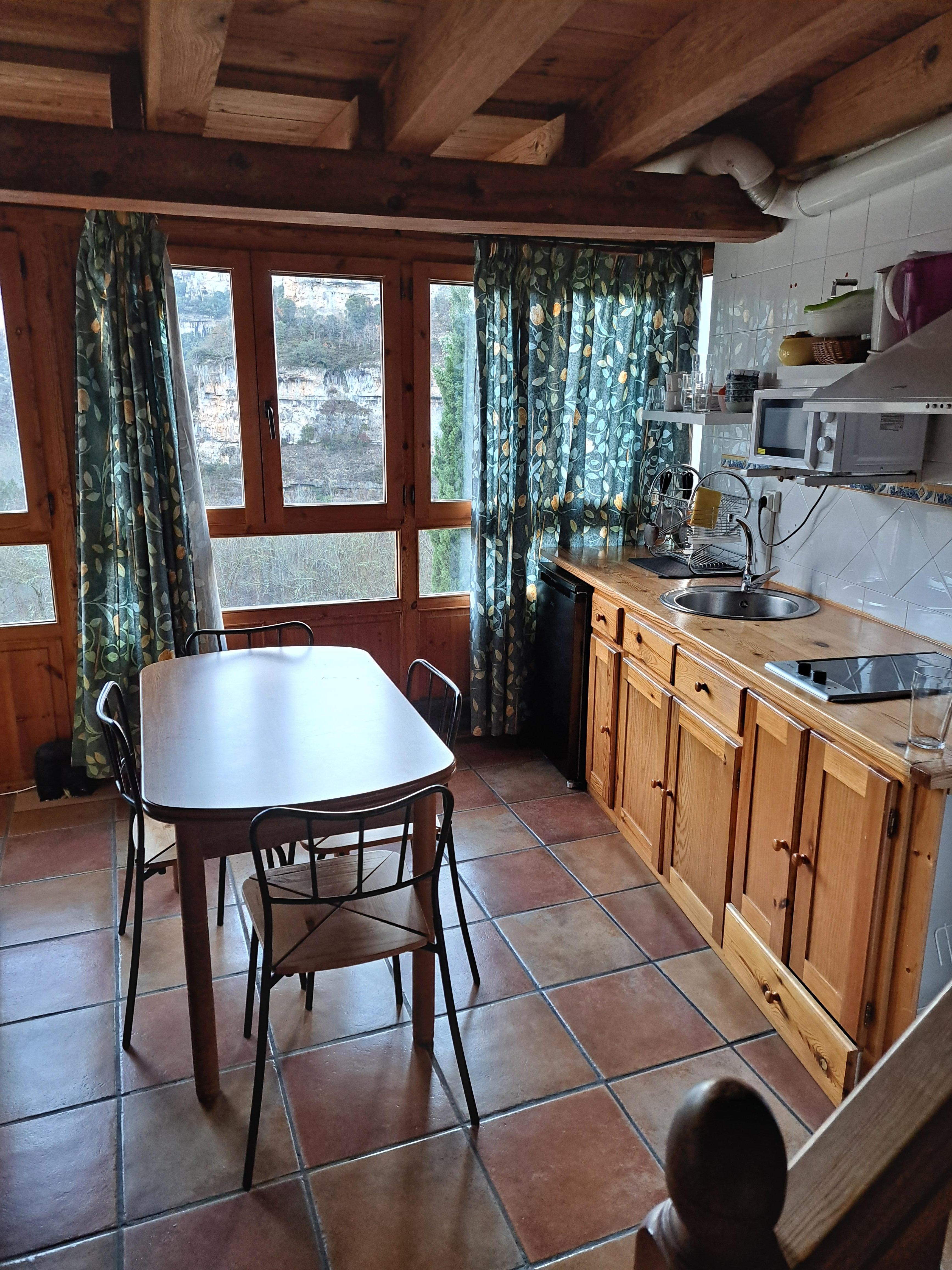 2nd level of the House. Nice kitchen, sofa and tv.