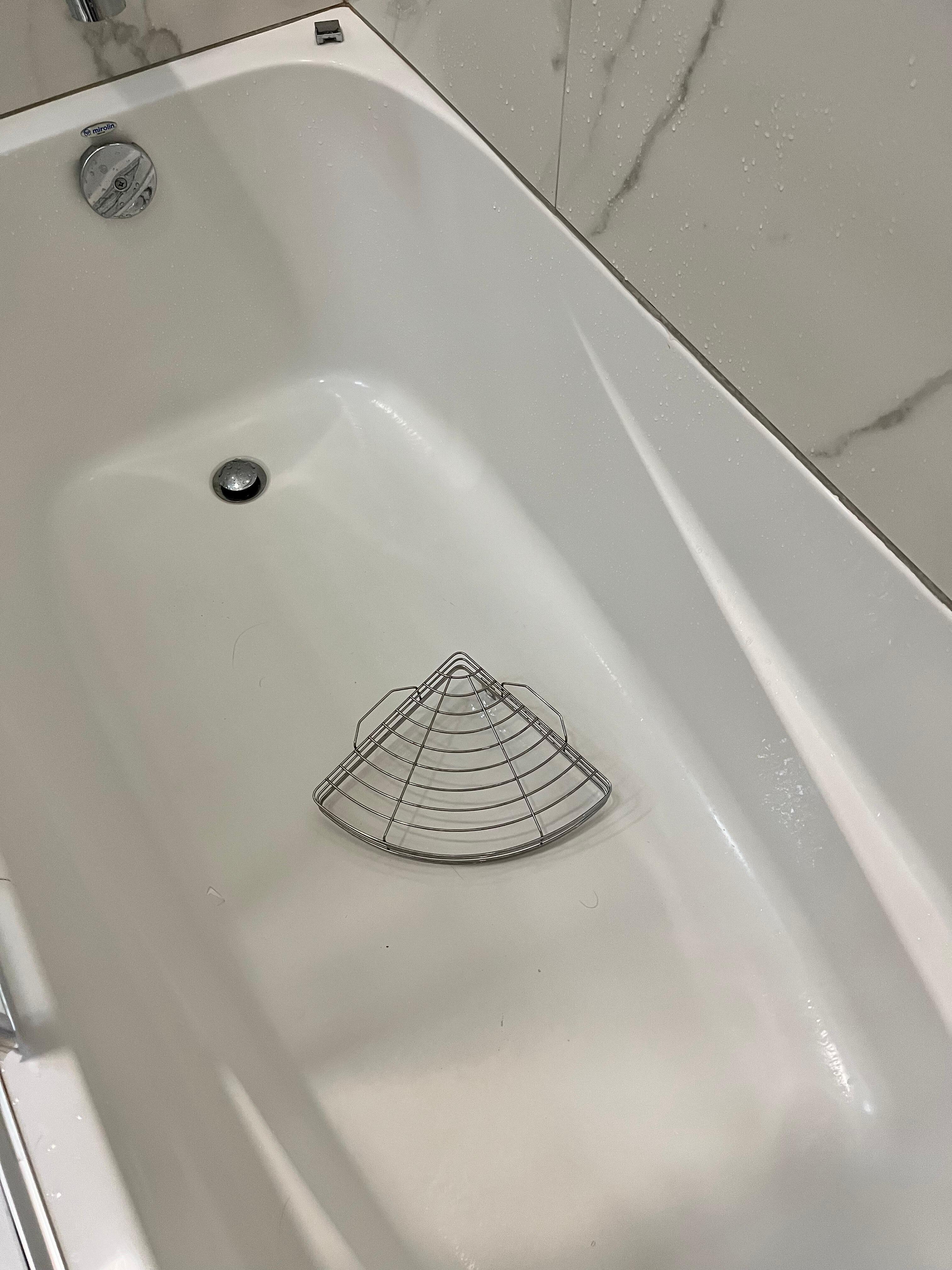 Tub that didn't drain with broken shelf.