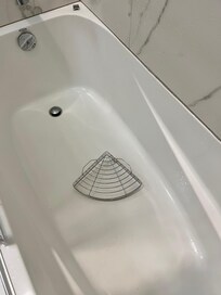 Tub that didn't drain with broken shelf.