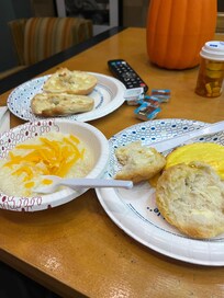 The buffet had bagels, biscuits, cheese omelet and grits