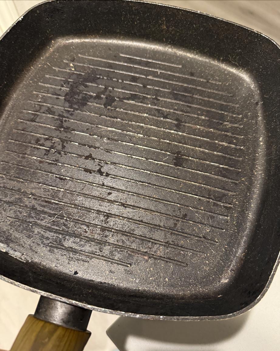 Pan in the kitchen - covered in burnt food, not cleaned