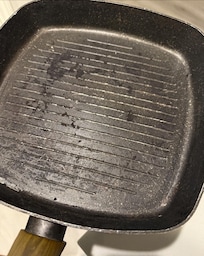 Pan in the kitchen - covered in burnt food, not cleaned