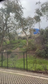 Tractor trailer whizzing by and trash right outside my window