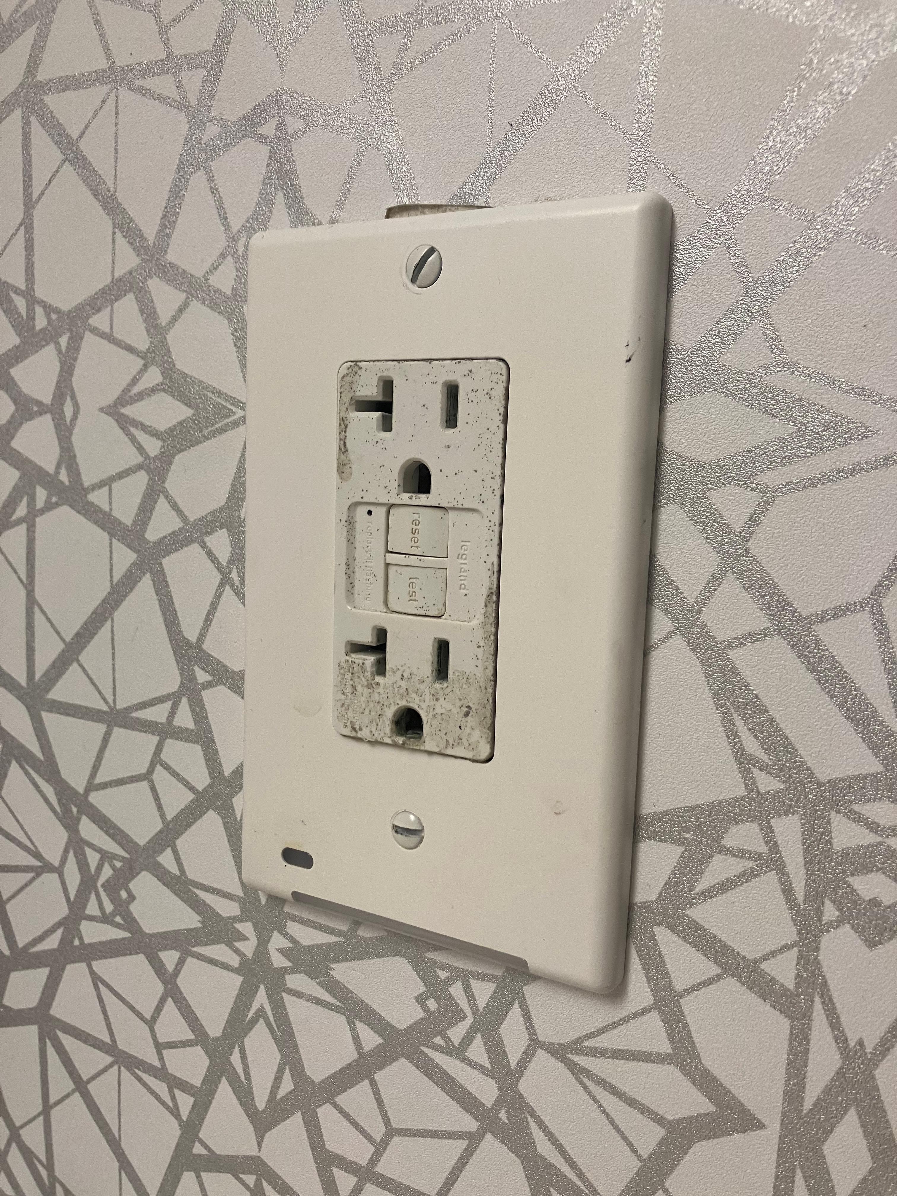 dirty outlet in bathroom