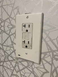 dirty outlet in bathroom