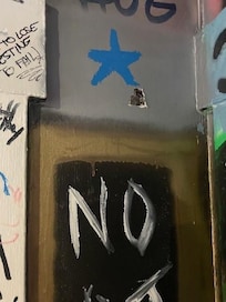 One of the holes in the wall
