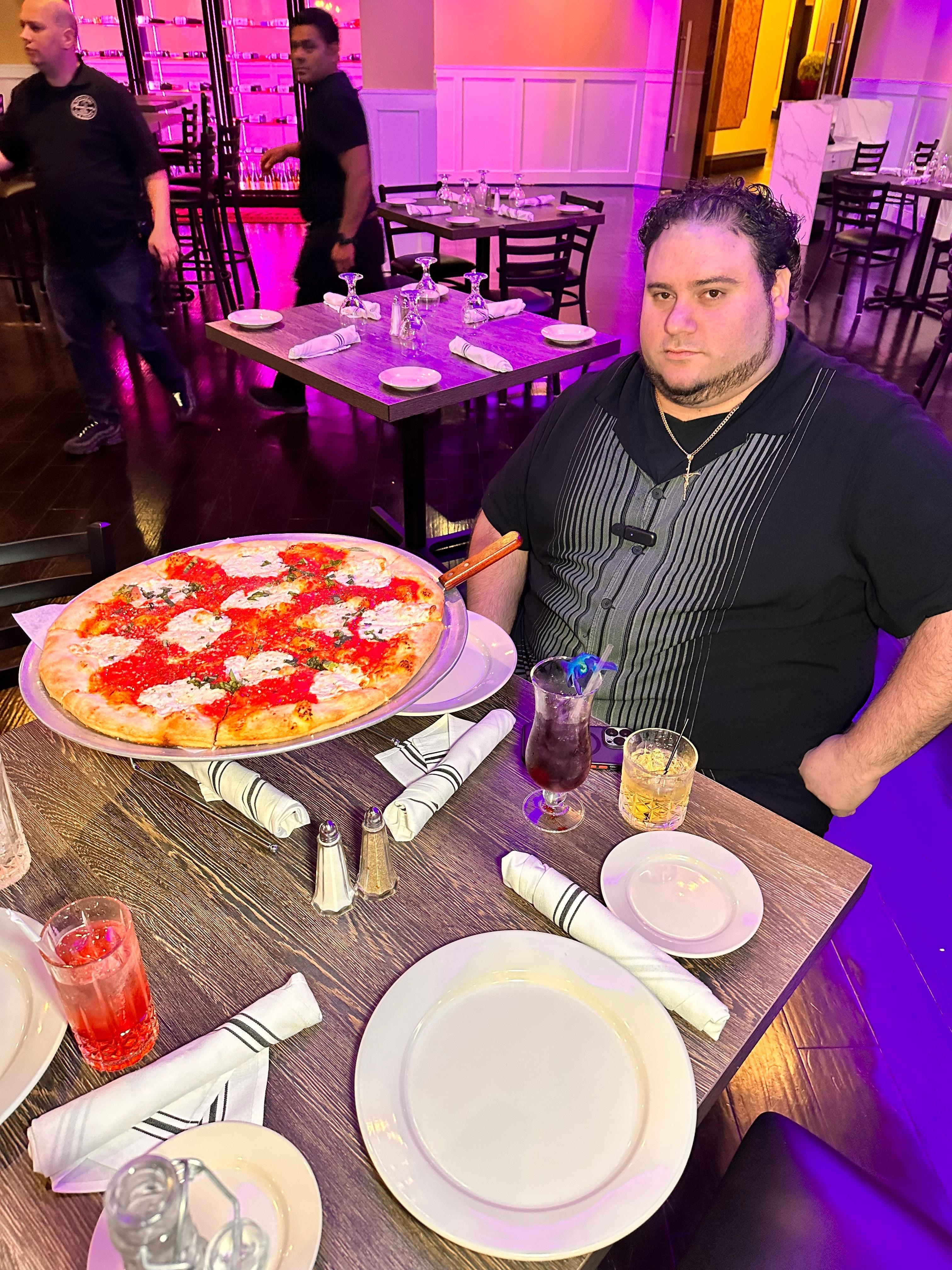 Tony Slice eating a pizza down in the restaurant
