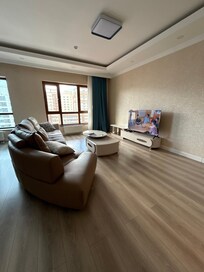 Clean spacious living room with big tv. Well lighted which I like.