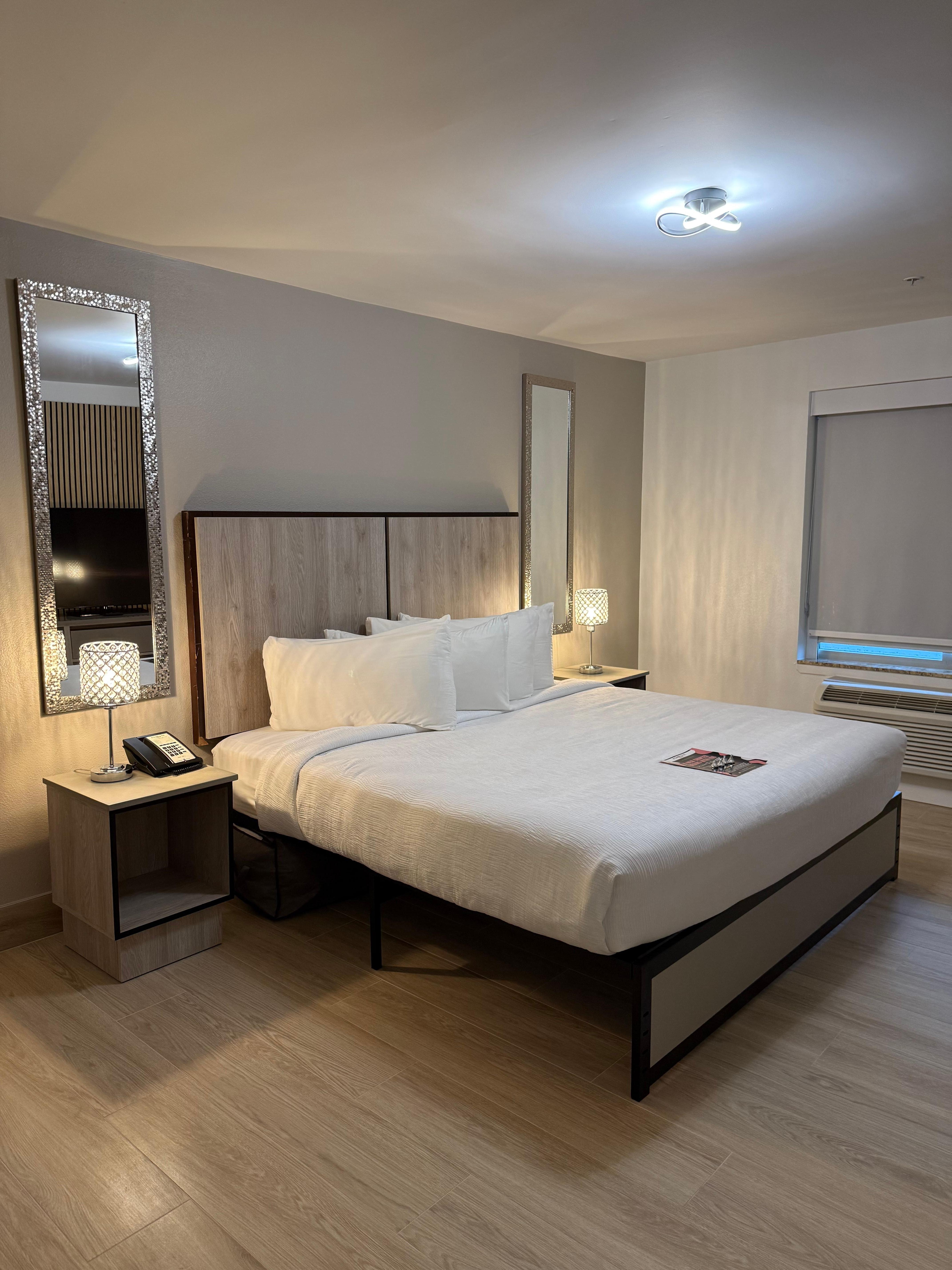 This is the bedroom with the king size bed. The lamps beside the bed or touch lamps, they dim or brighten just by touching them.