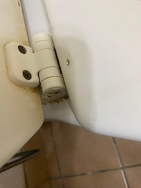 Floor in bathroom behind door