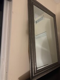 Picture of Unsecured Mirror and dresser plus partially burnt out light