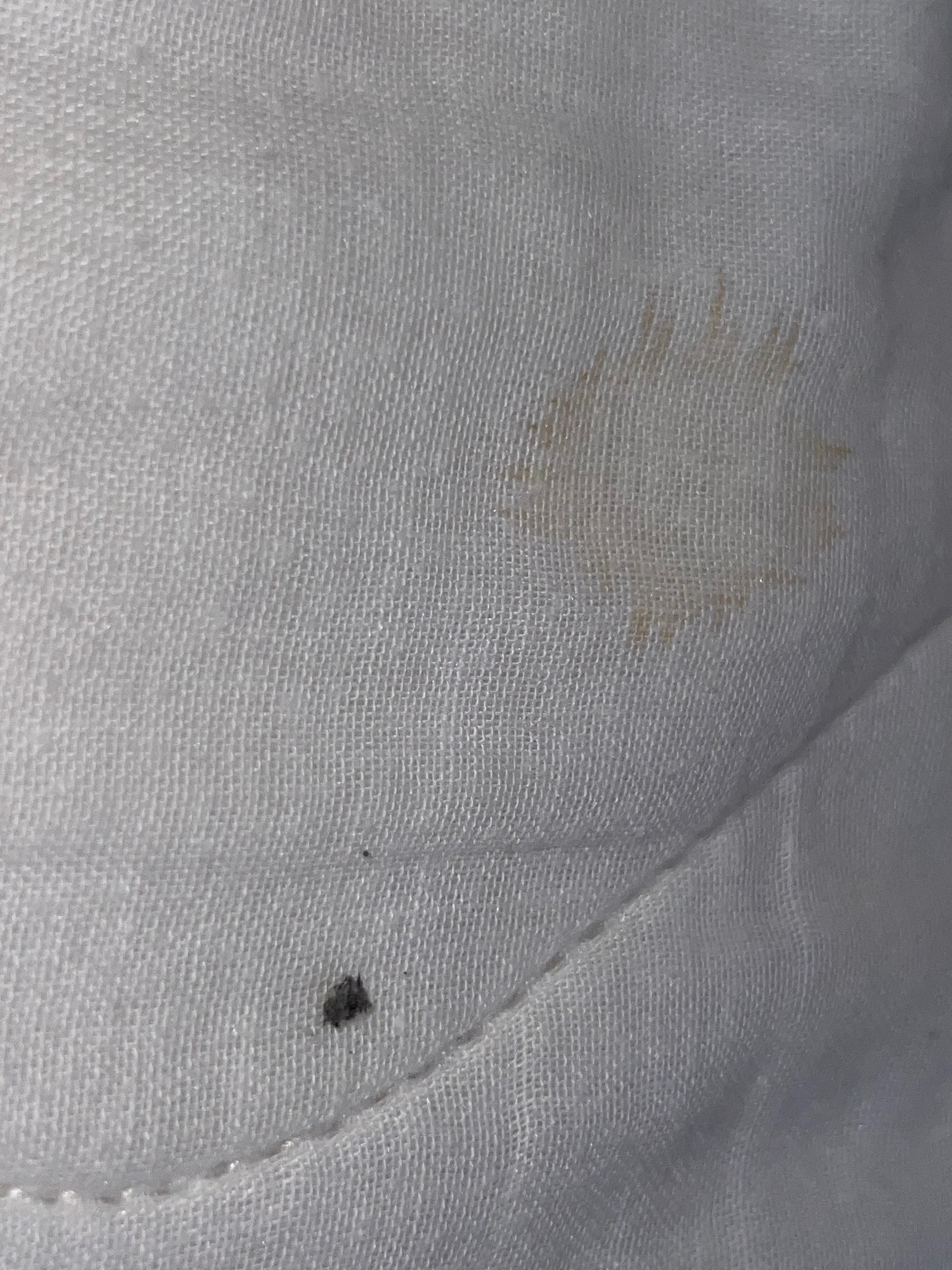 were other spots on the sheets and stained behind the bed near the pillows