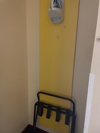 Clothes rack no longer behind door.