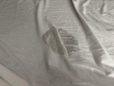 Threadbare, bleach-burned sheets.