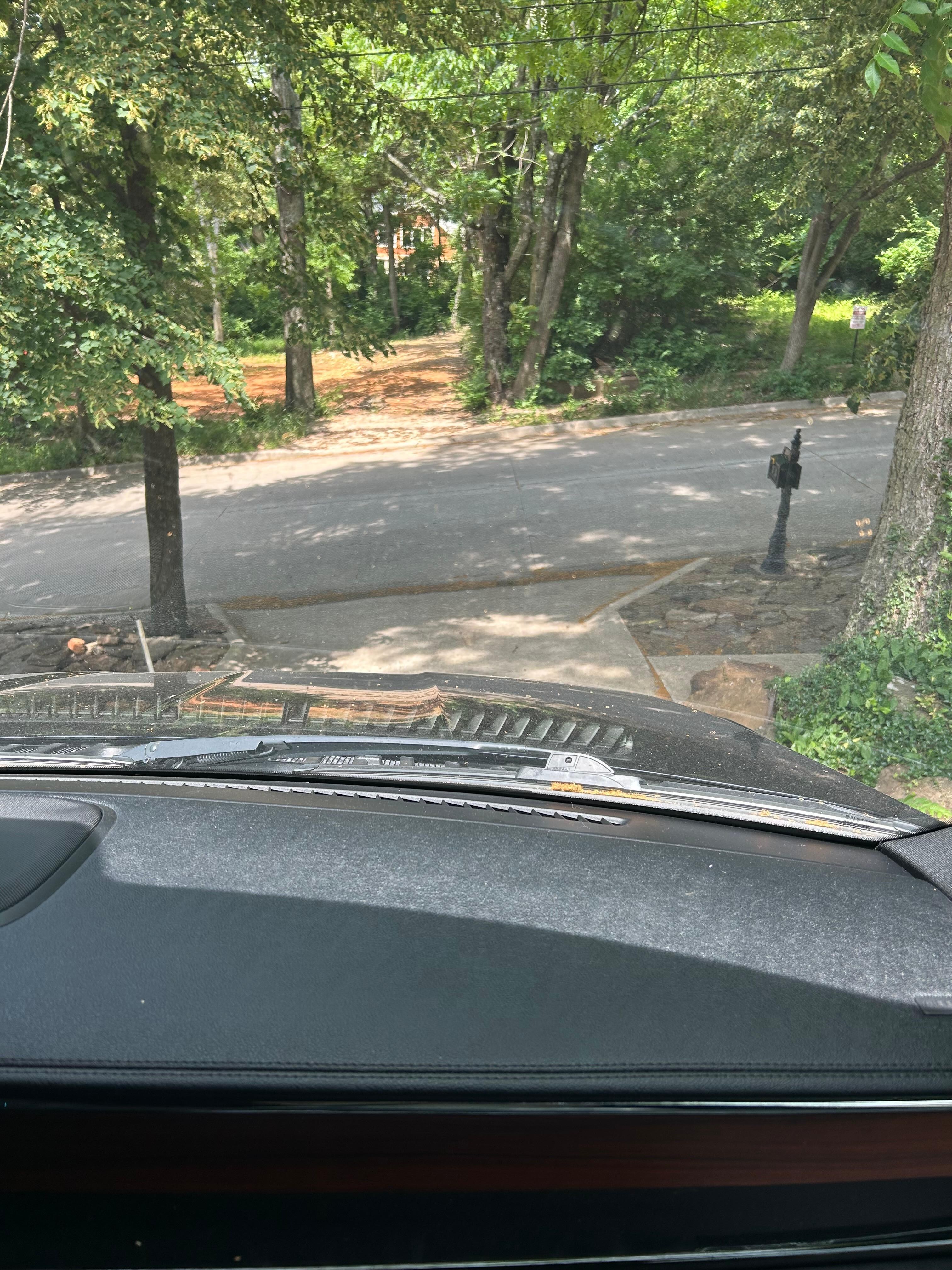 View of the steep driveway from a passenger seat perspective. 