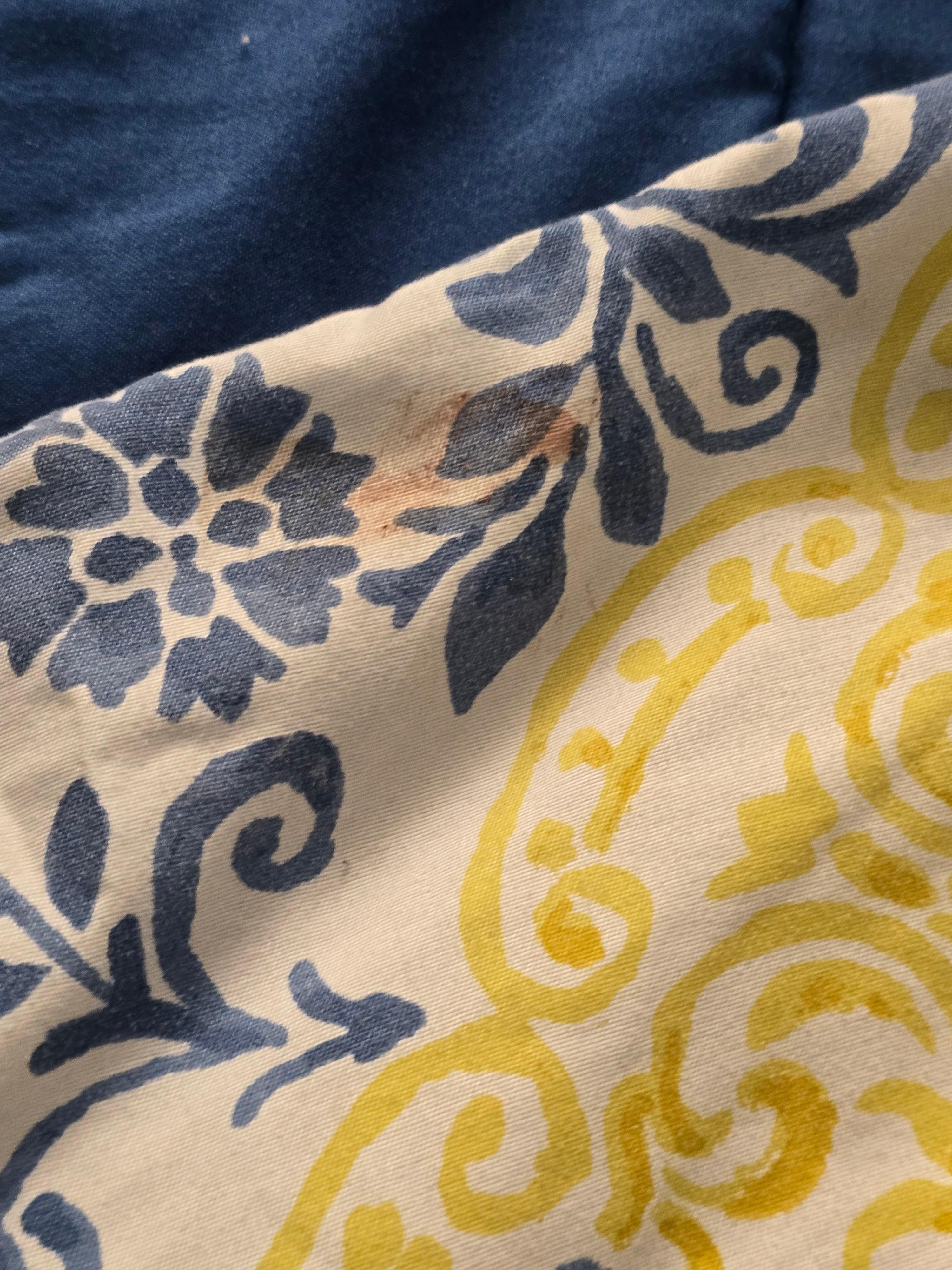 Brown stain on Bedding.