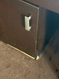 Cabinet where refrigerator is located. 1st room