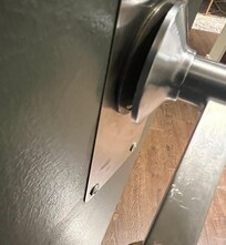 Door handle that did close but it wasn’t securely attached to the door. Like there had been a previous attempted break in. It felt like it could be easily removed if someone wanted to remove it.