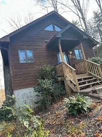 This is what you see when you drive up. Larger porch on back with great view.