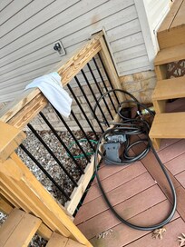 Previous guests things and hose left strewn on deck