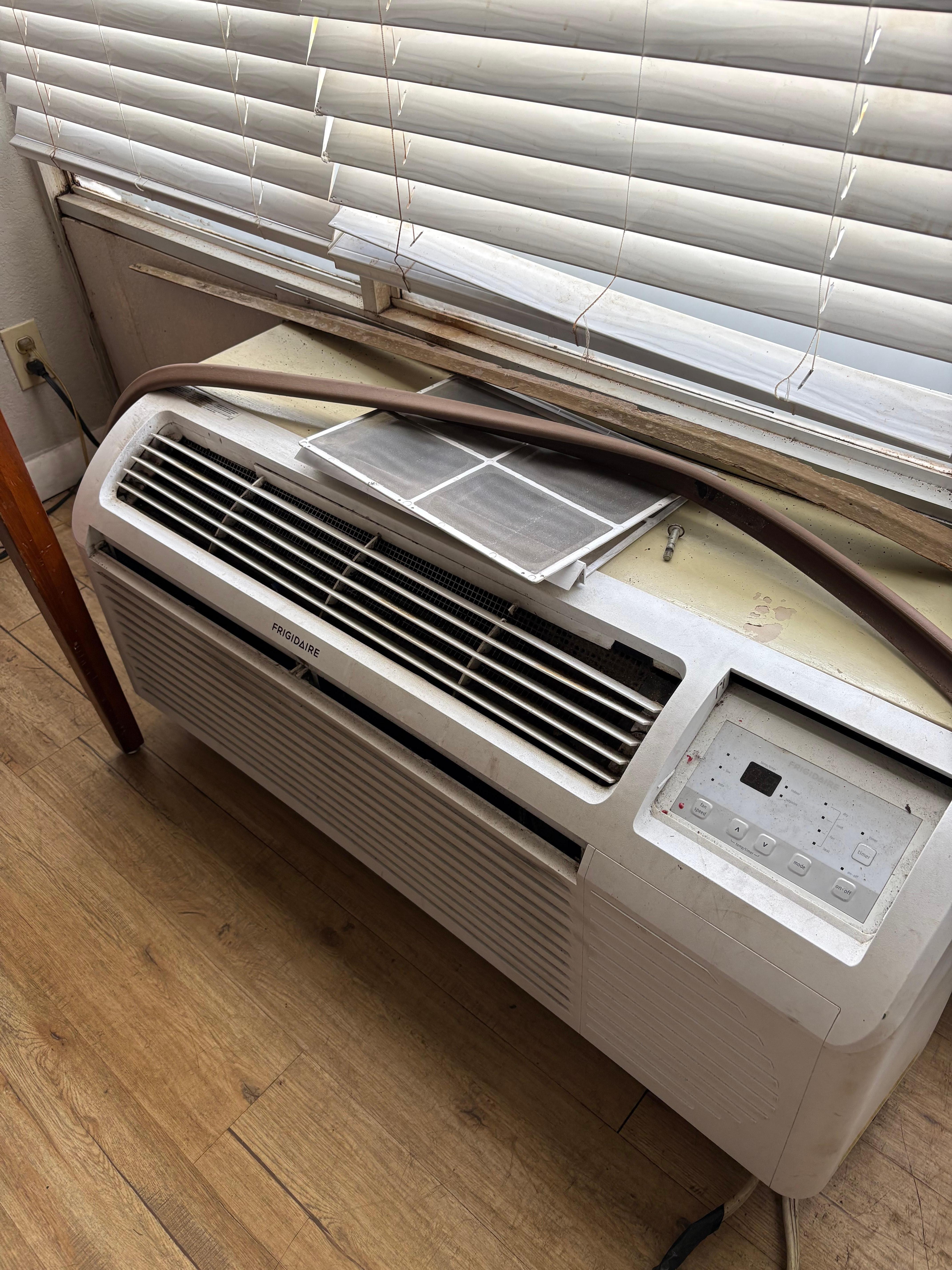 The ac unit was in pieces looks unsafe to me.