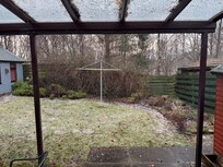 Arrival. View of back garden.