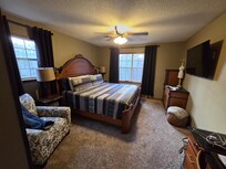 The "master" bedroom is very comfortable! It has a walk in closet attached as well. There is also a desk in this room.