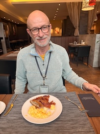 He loves the breakfast.
