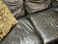 The couch will peel and leave black flakes all over you