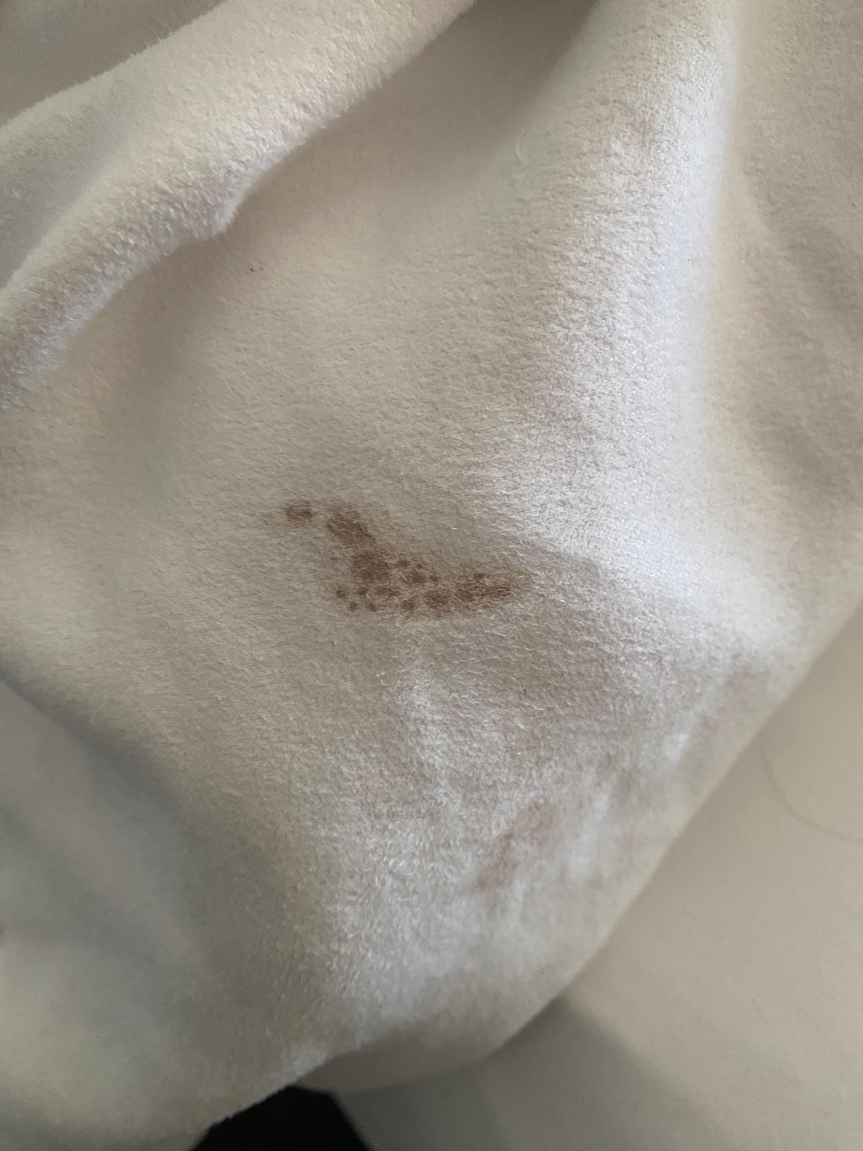 Found on bedding, was able to scratch some off with the back of the key card. 