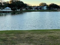 Another view looking across the lake toward the unit.