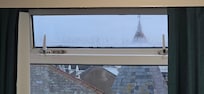Windows that haven't been cleaned and have a black mould like substance to them.