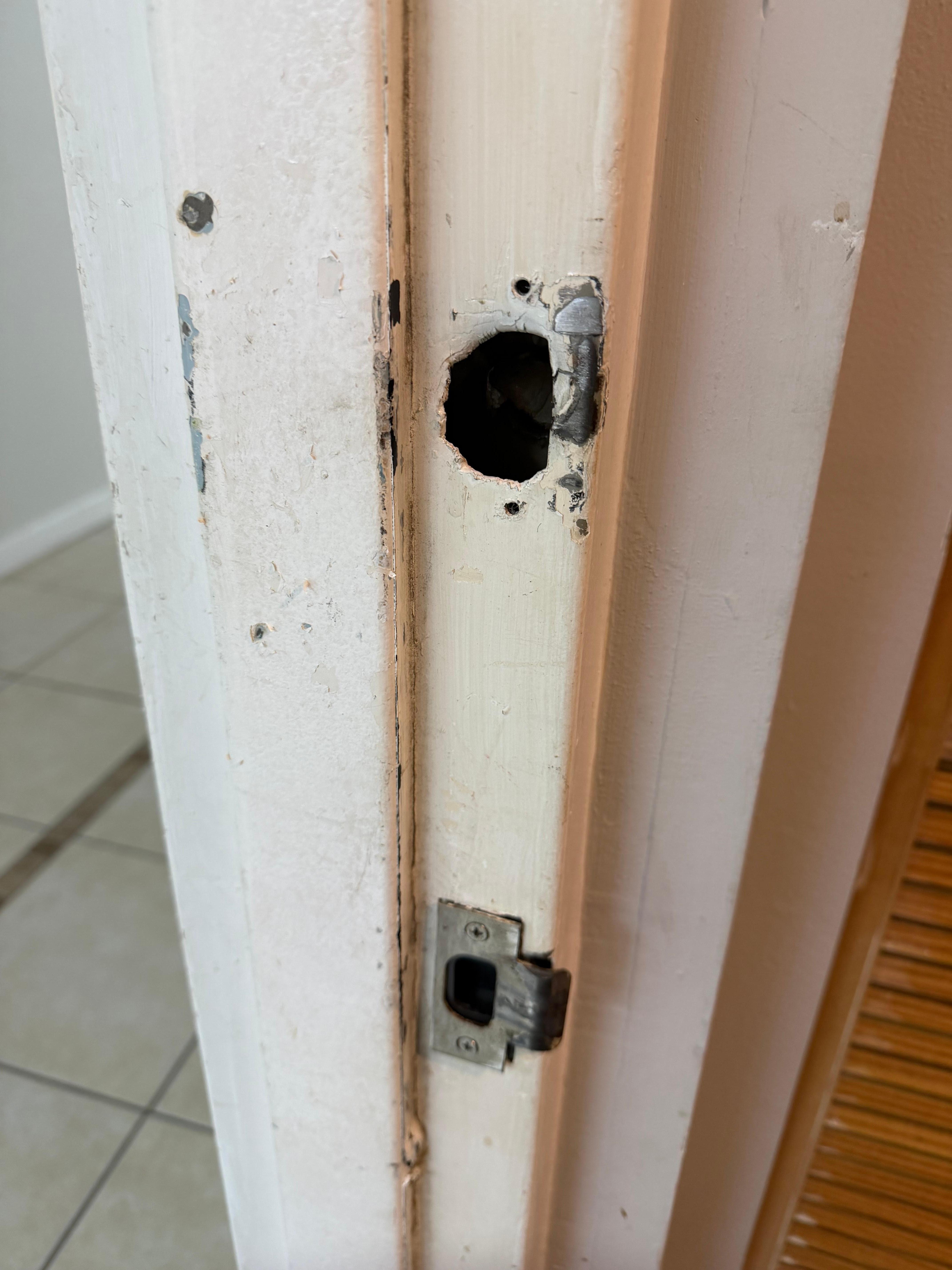 exterior door latch plate - looks like it's been broken and repaired