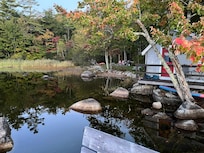 view of the cove and one cabin