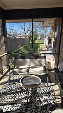 Screened in porch leading to the back yard