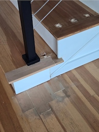 Putty up the staircase, raw wood, floor not done