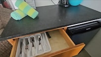 Cutlery, mugs, cups are in the cabinet and drawers along with electric water kettle. A good size fridge and microwave and coffee maker (bring your own coffee).