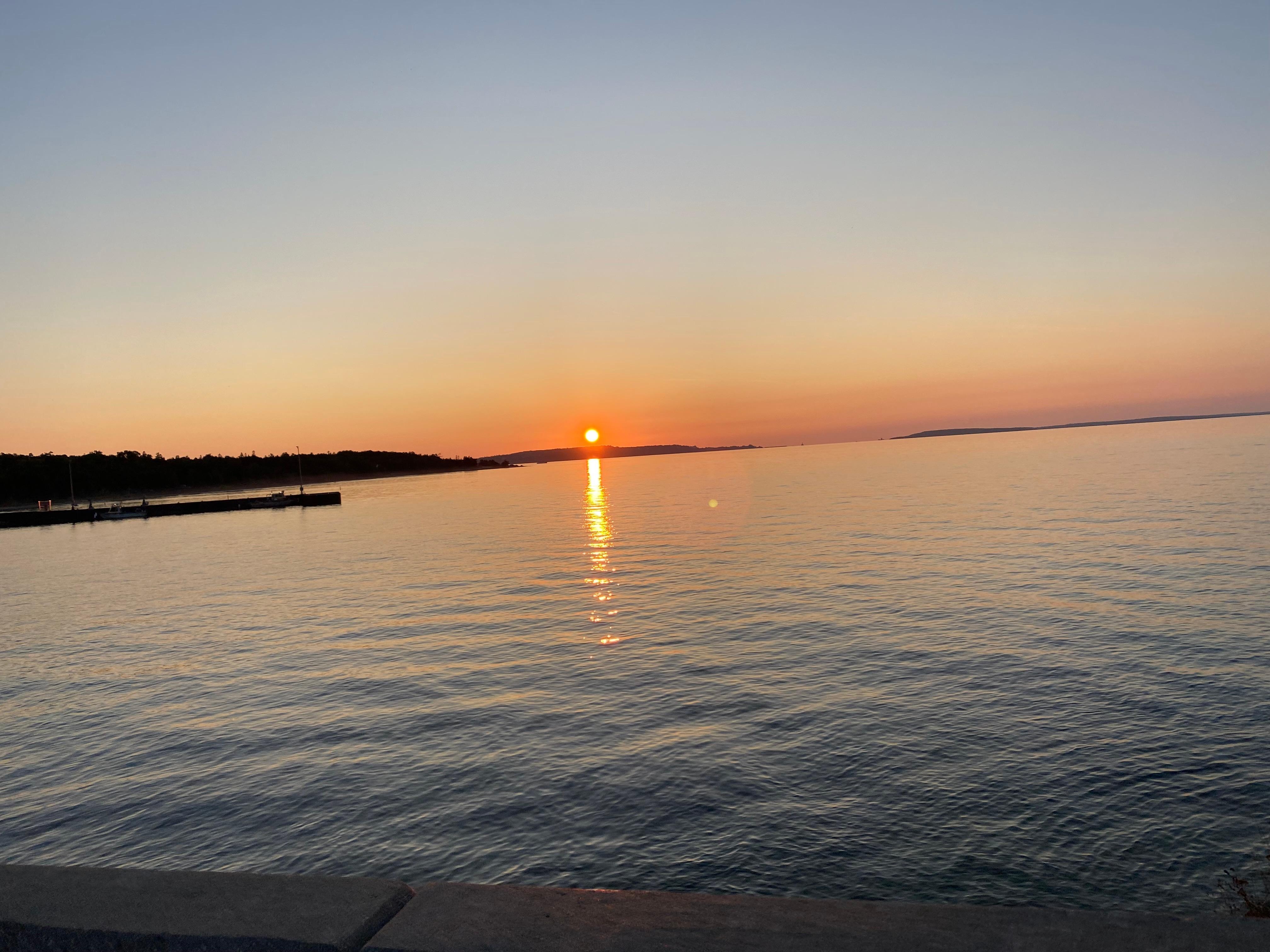 Sunrise while walking across bridge. 