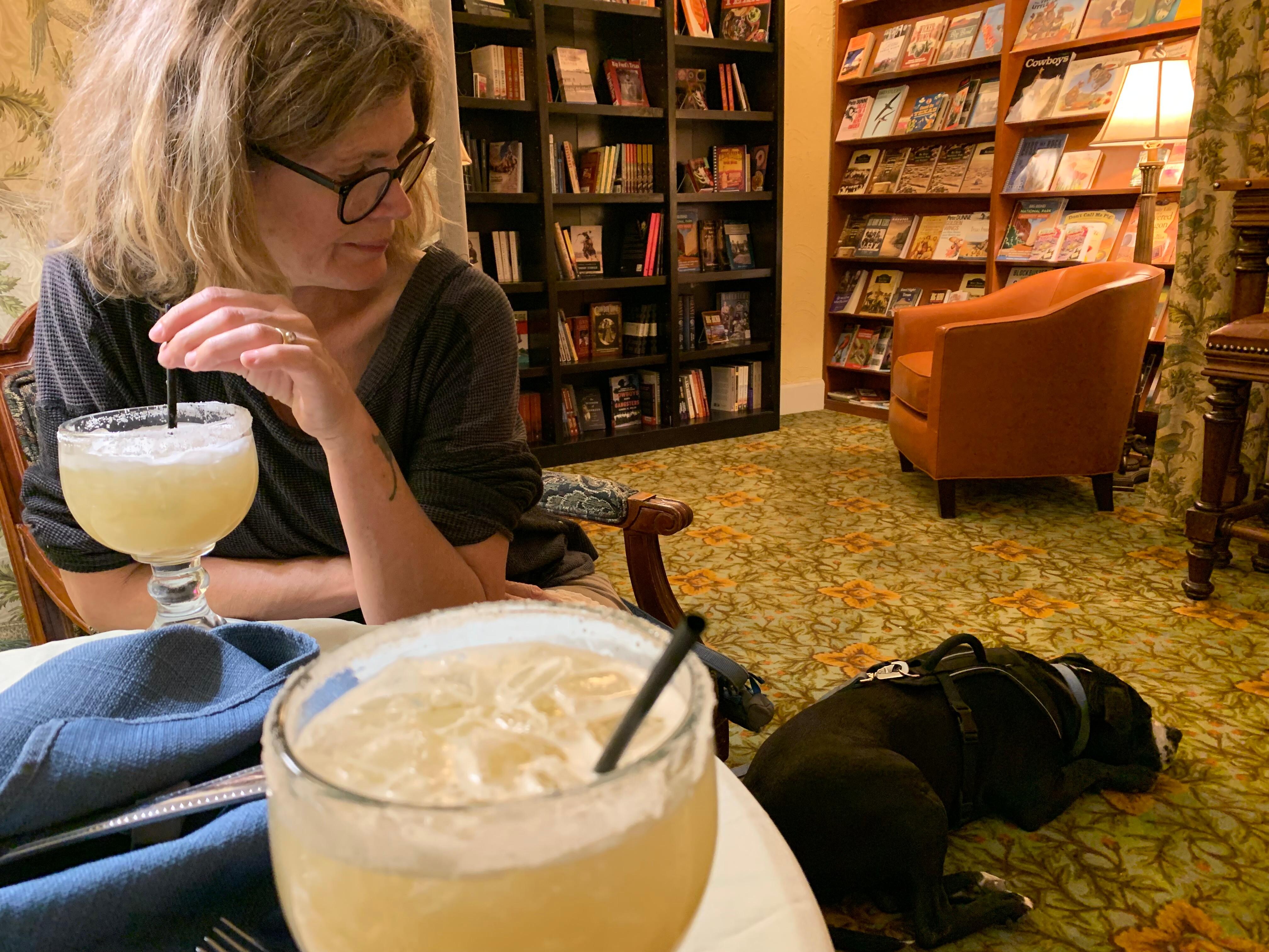 Enjoying margaritas in the library with our dog